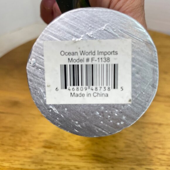 Green Ceramic Frog Figurine With Wine Glass Sitting In Modern White Chair - Picture 8 of 10